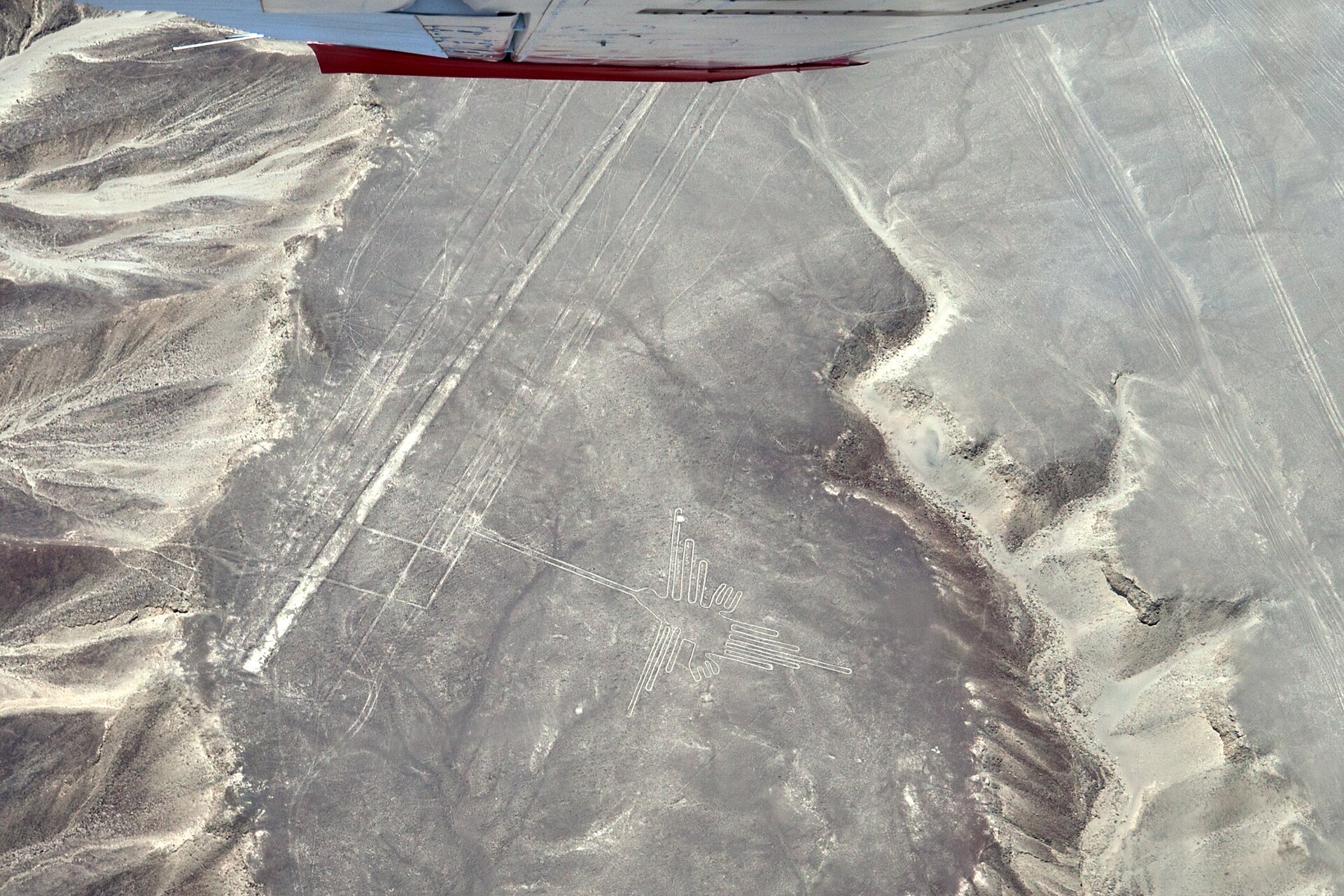 Aerial photograph of the Nazca Lines hummingbird geoglyph etched into the desert floor of southern Peru.